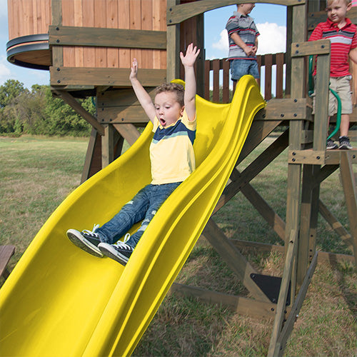 happy kid on swing set slide